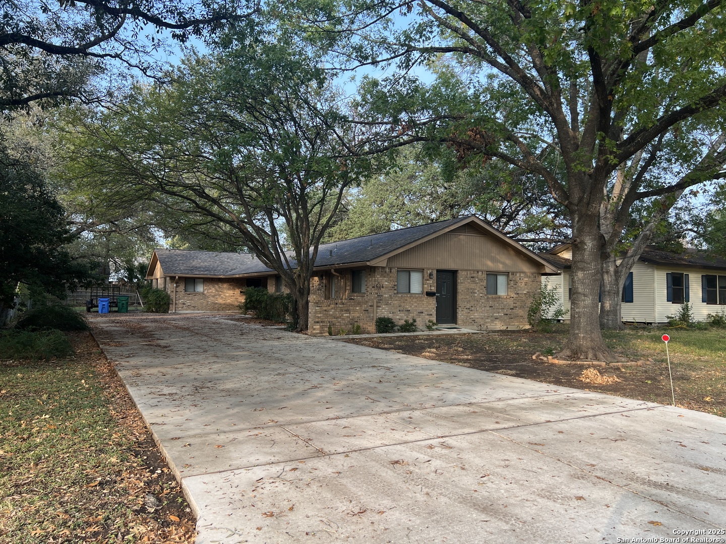 624 East Elm Street, Unit 1 Seguin, TX 78155 - Photo 18 of 19 a wooden house with trees in front of it