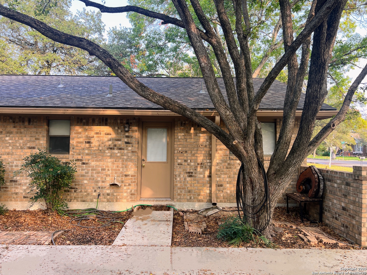 624 East Elm Street, Unit 1 Seguin, TX 78155 - Photo 4 of 19 a front view of a house with garden