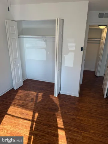a view of a room with wooden floor and staircase