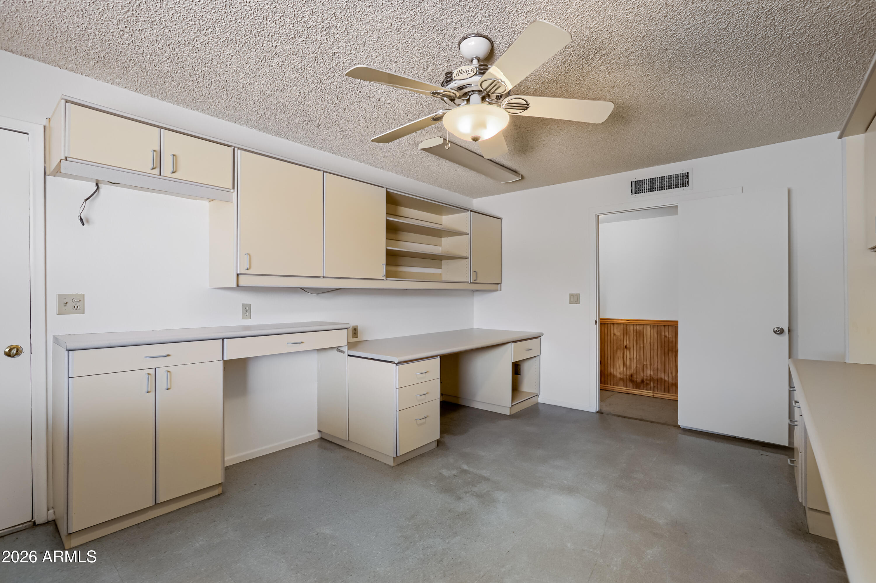 3823 West Greenway Road Phoenix, AZ 85053 - Photo 14 of 28 a kitchen with white cabinets and white appliances