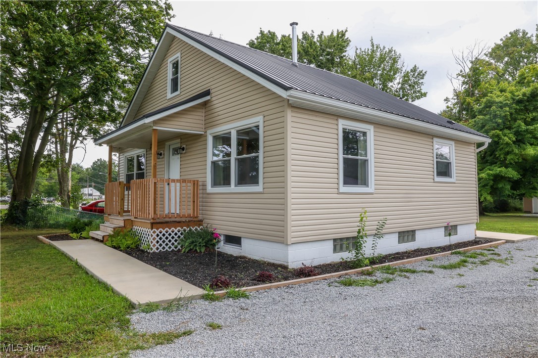 3181 Dover Road Wooster, OH 44691 - Photo 2 of 25 View of side of home featuring a porch