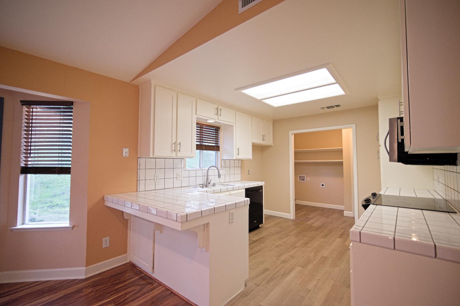 33072 Black Mountain Road Tollhouse, CA 93667 - Photo 12 of 45 a bathroom with a granite countertop sink and a mirror