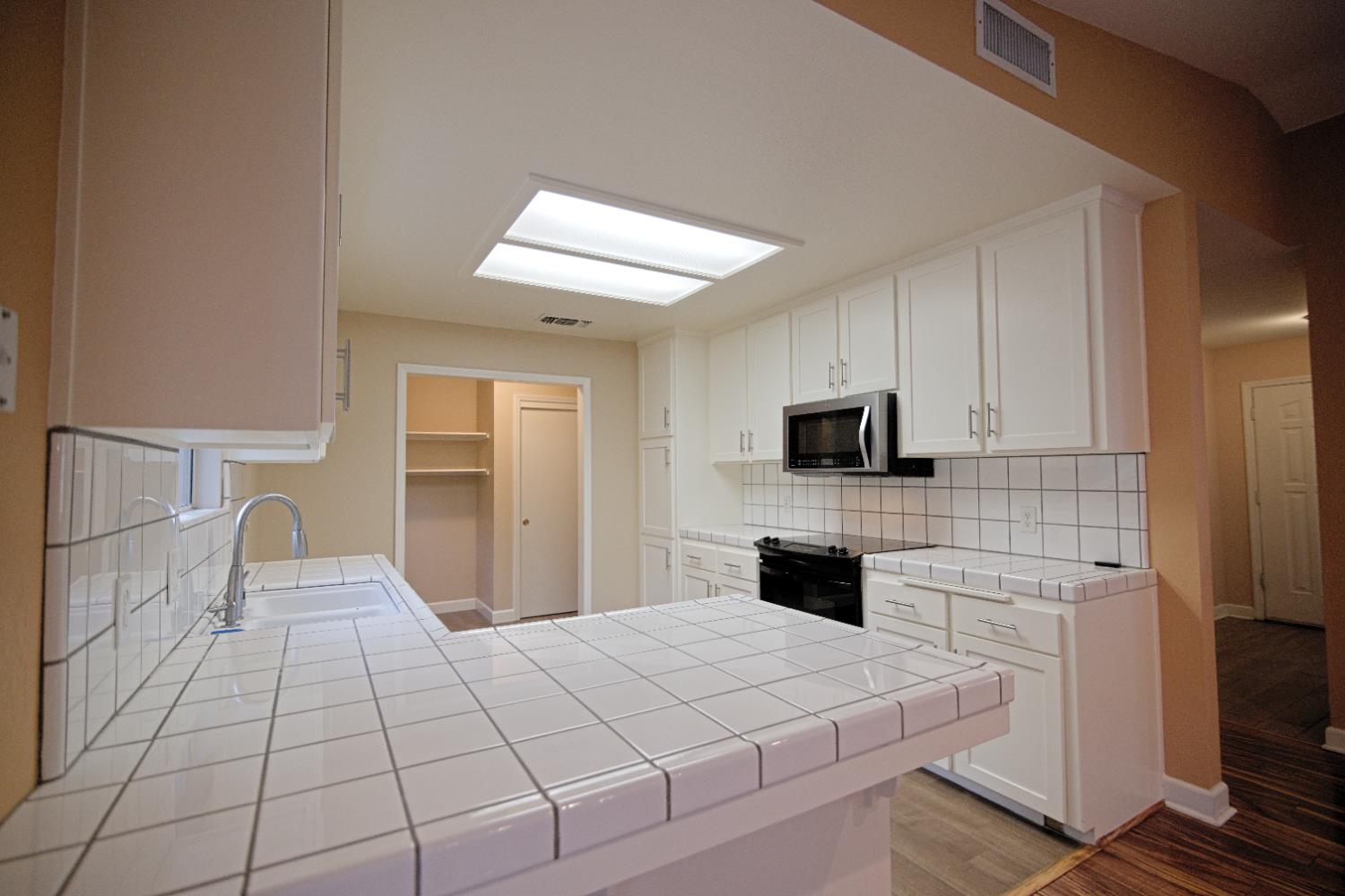 33072 Black Mountain Road Tollhouse, CA 93667 - Photo 13 of 45 a bedroom with a bed and a flat screen tv