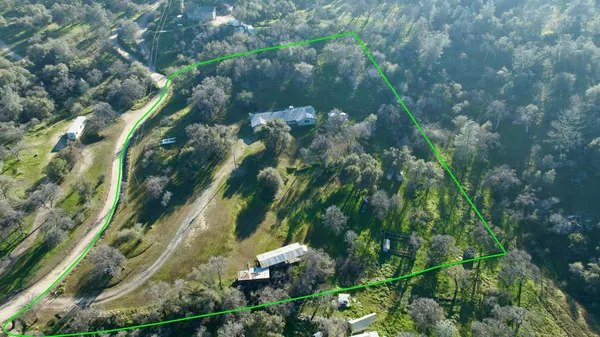 a front view of a house with yard porch and green space