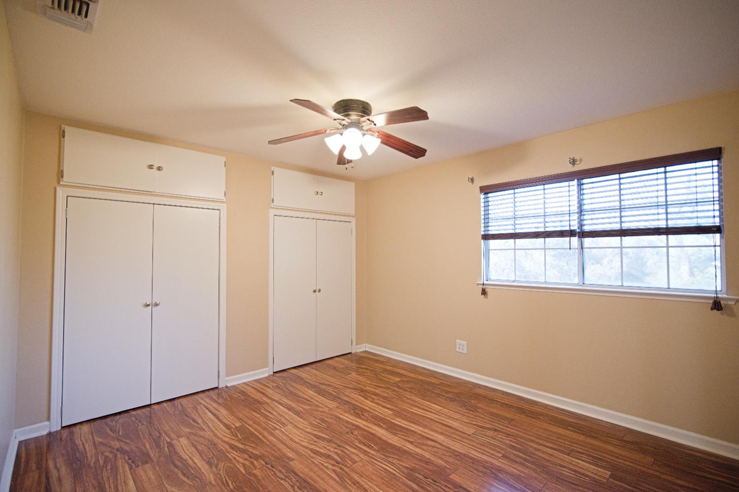33072 Black Mountain Road Tollhouse, CA 93667 - Photo 26 of 45 a view of empty room with wooden floor and fan
