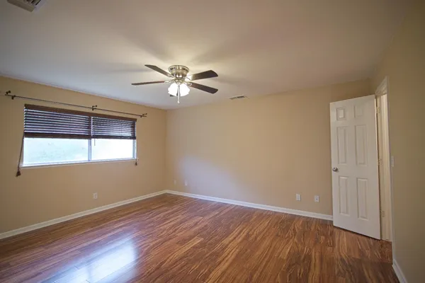 a view of front door with wooden floor