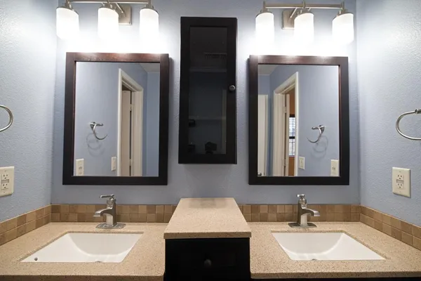 a bathroom with a sink and a mirror