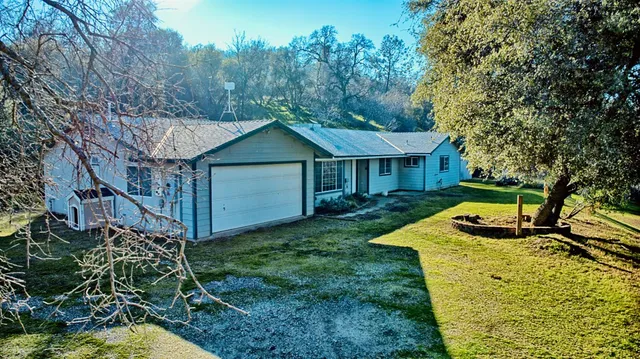 a front view of a house with yard porch and green space