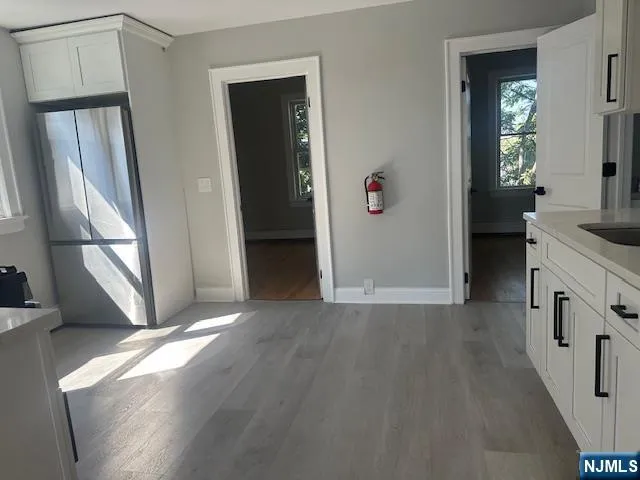 a view of livingroom with hardwood floor and hallway