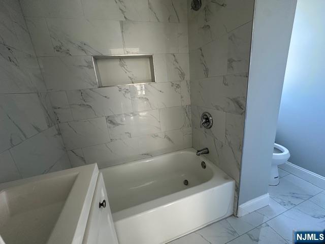 6 Pleasant Avenue, Unit 2 Clifton, NJ 07013 - Photo 6 of 14 a bathroom with a bathtub and a toilet