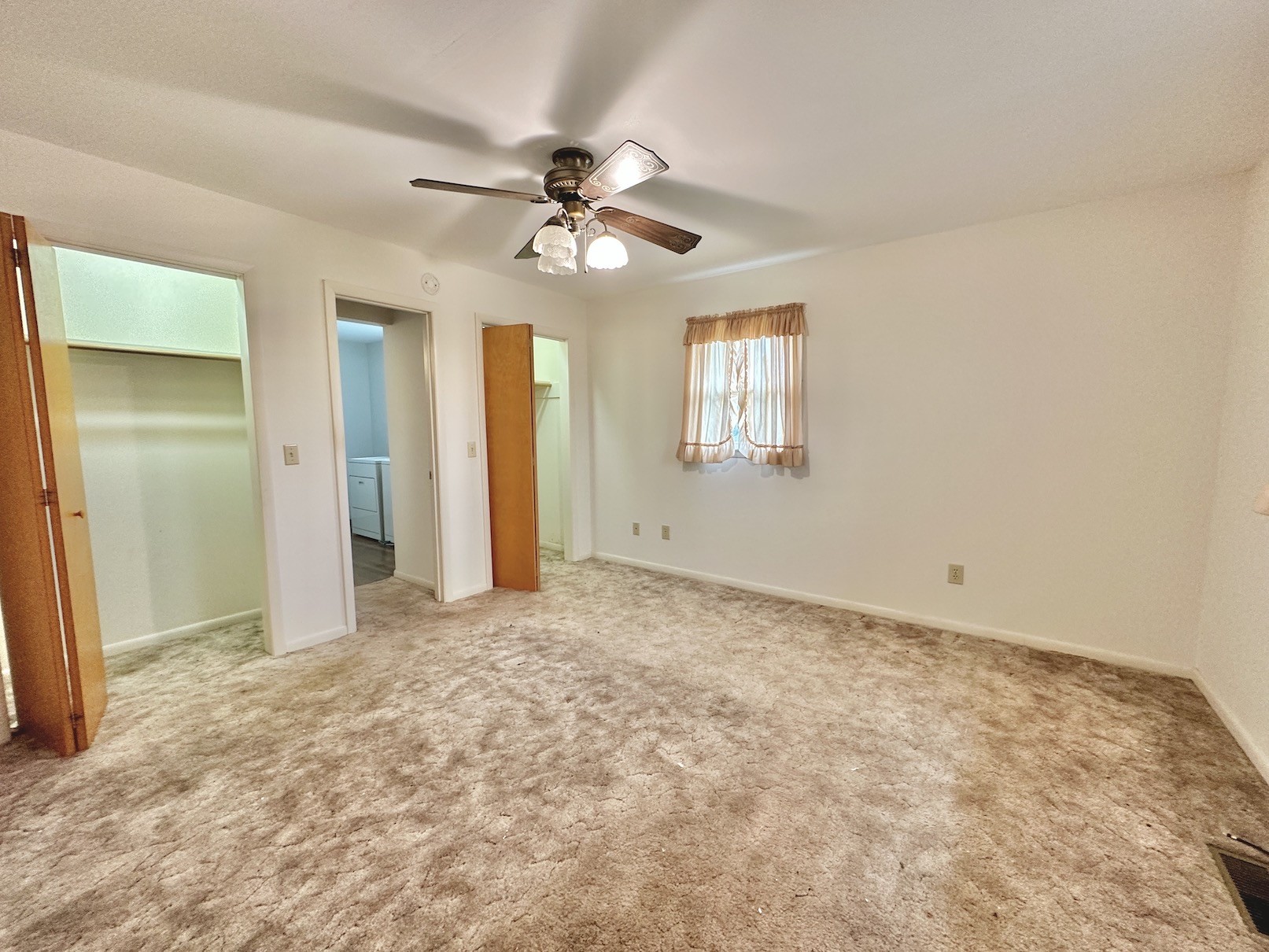 358 Jimtown Road Woodbury, TN 37190 - Photo 11 of 15 an empty room with windows and fan