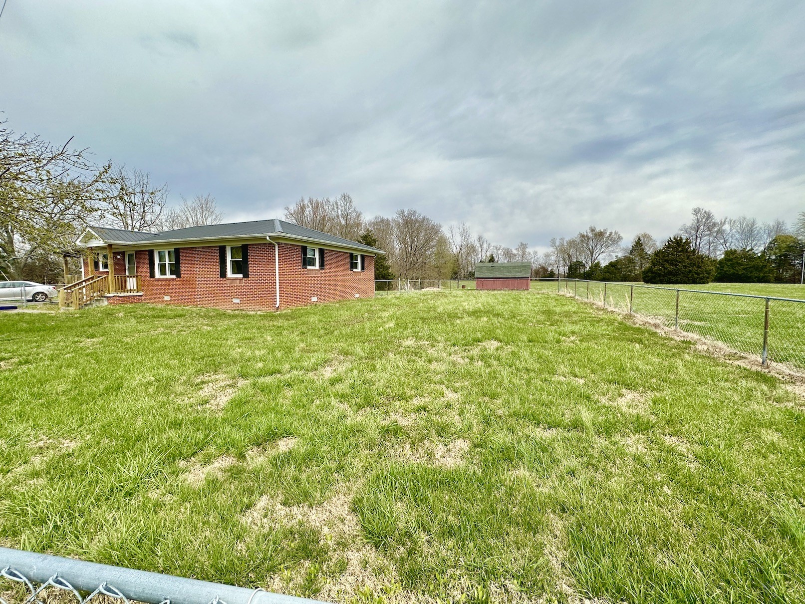 358 Jimtown Road Woodbury, TN 37190 - Photo 2 of 15 a big yard with large trees