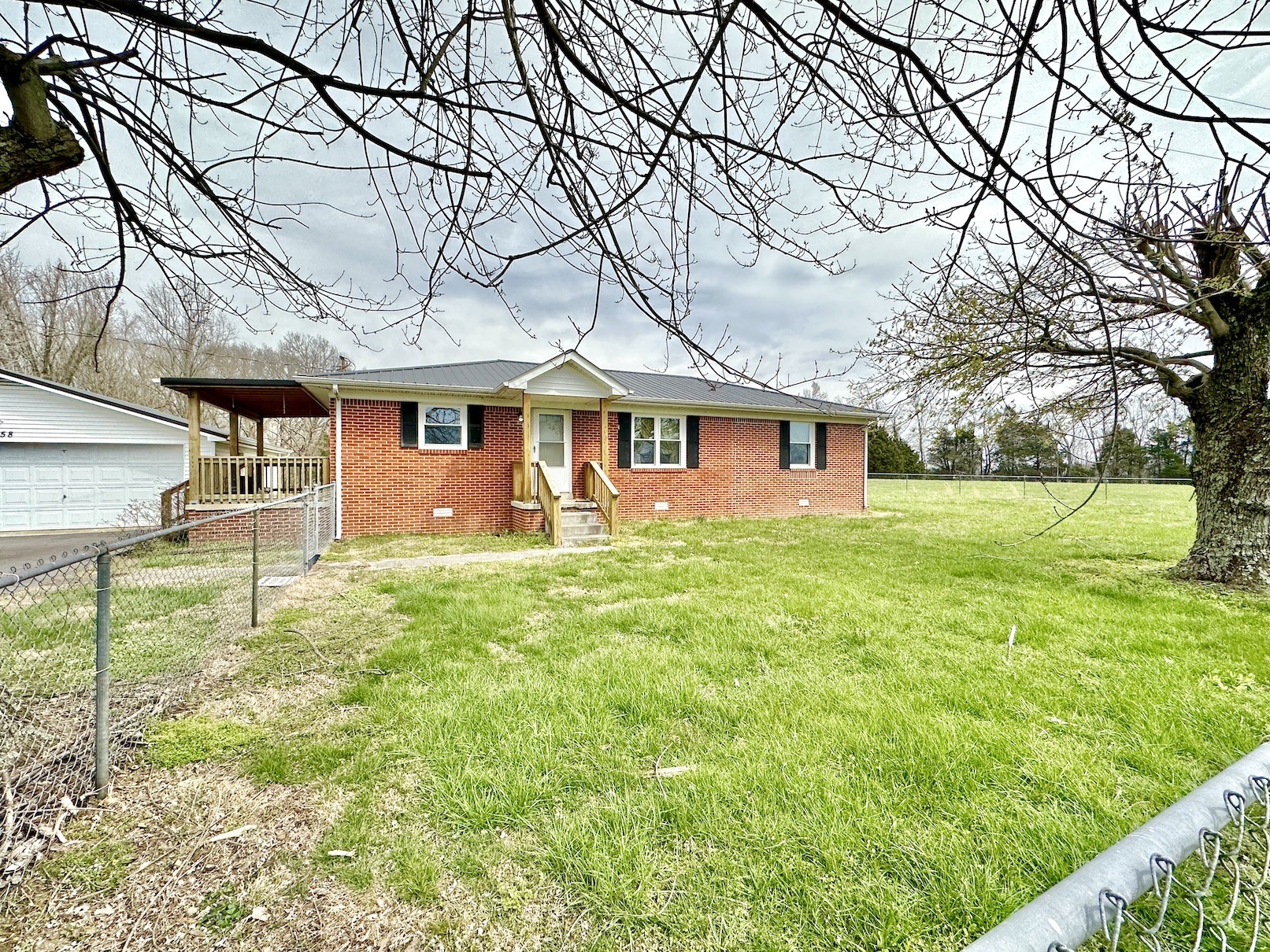358 Jimtown Road Woodbury, TN 37190 - Photo 3 of 15 a front view of a house with garden