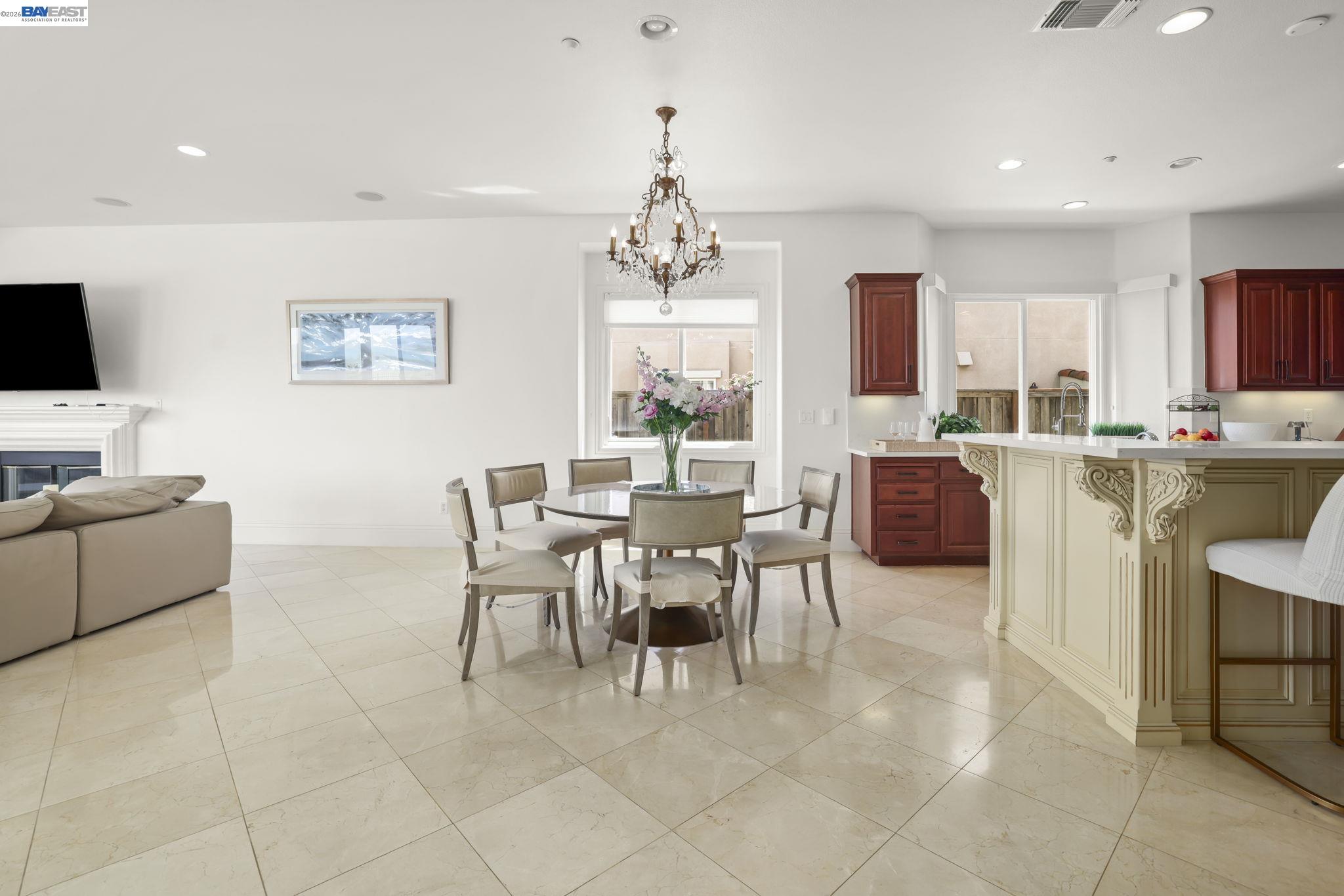 950 Winsford Court San Ramon, CA 94583 - Photo 18 of 68 a dining room with furniture and a chandelier