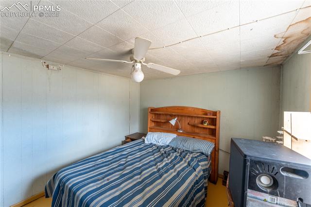 1331 Forest Road Colorado Springs, CO 80906 - Photo 9 of 13 Bedroom with a ceiling fan
