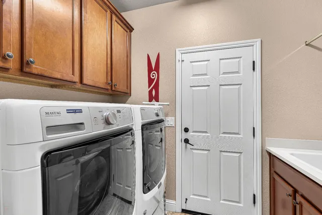a view of a chairs and table in the garden