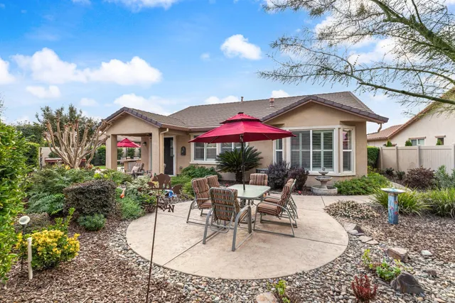 an aerial view of a residential houses with outdoor space and street view