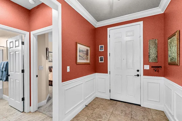 a living room with lots of furniture and a flat screen tv