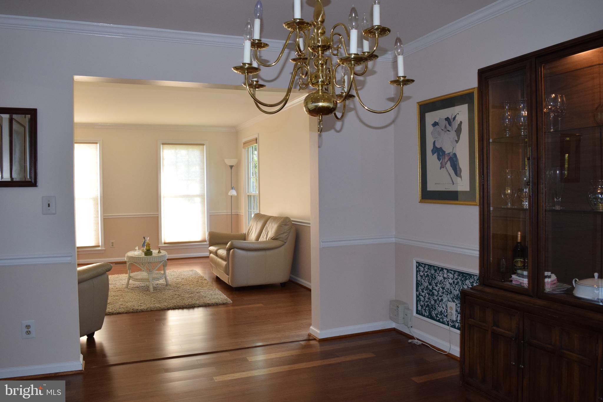 8198 Barnwood Road Manassas, VA 20110 - Photo 14 of 48 Living Room Dining Room w gleaming Bamboo Floors