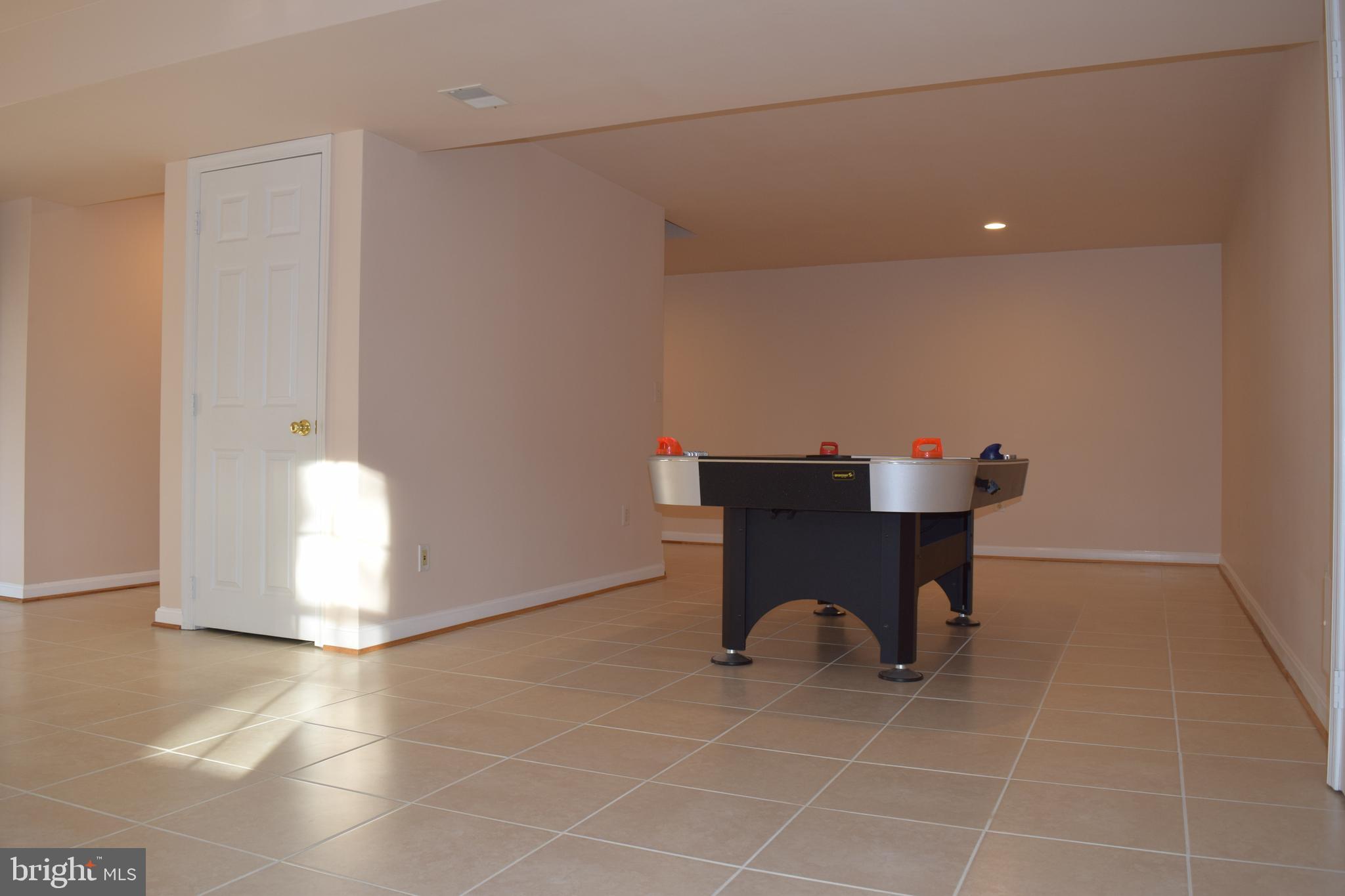 8198 Barnwood Road Manassas, VA 20110 - Photo 38 of 48 Ceramic Tile throughout basement