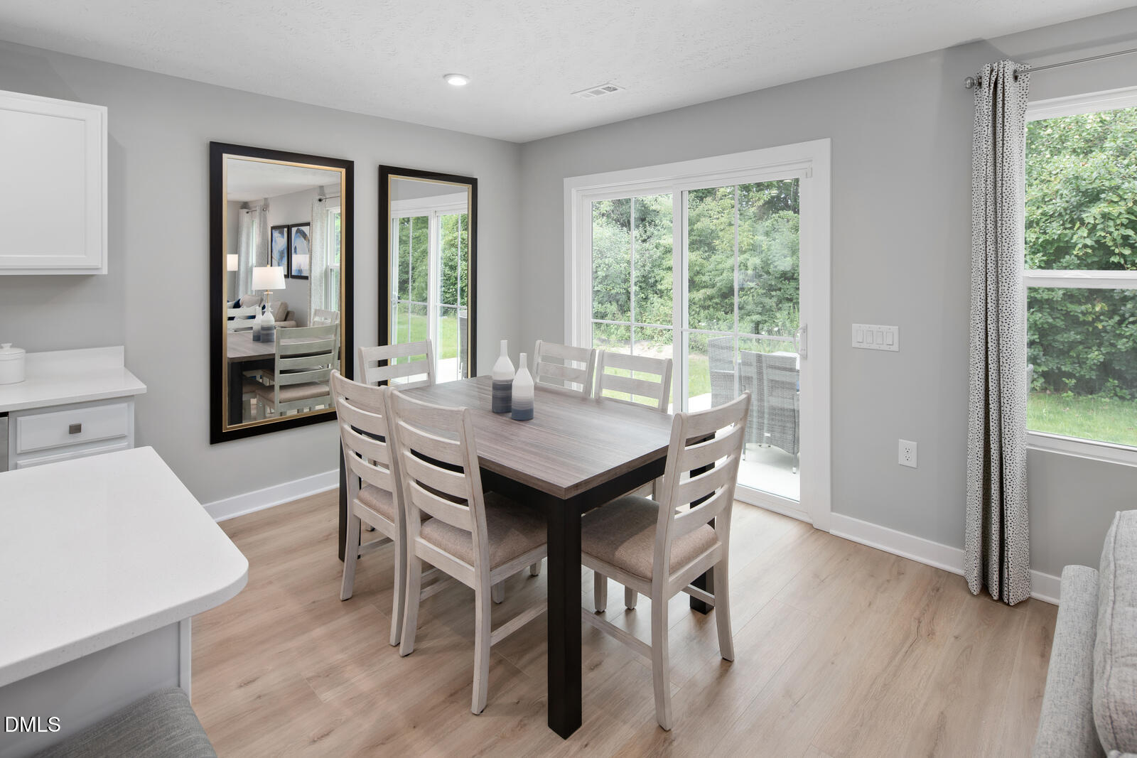 264 Matthiola Drive Wendell, NC 27591 - Photo 10 of 33 a view of a dining room with furniture window and wooden floor