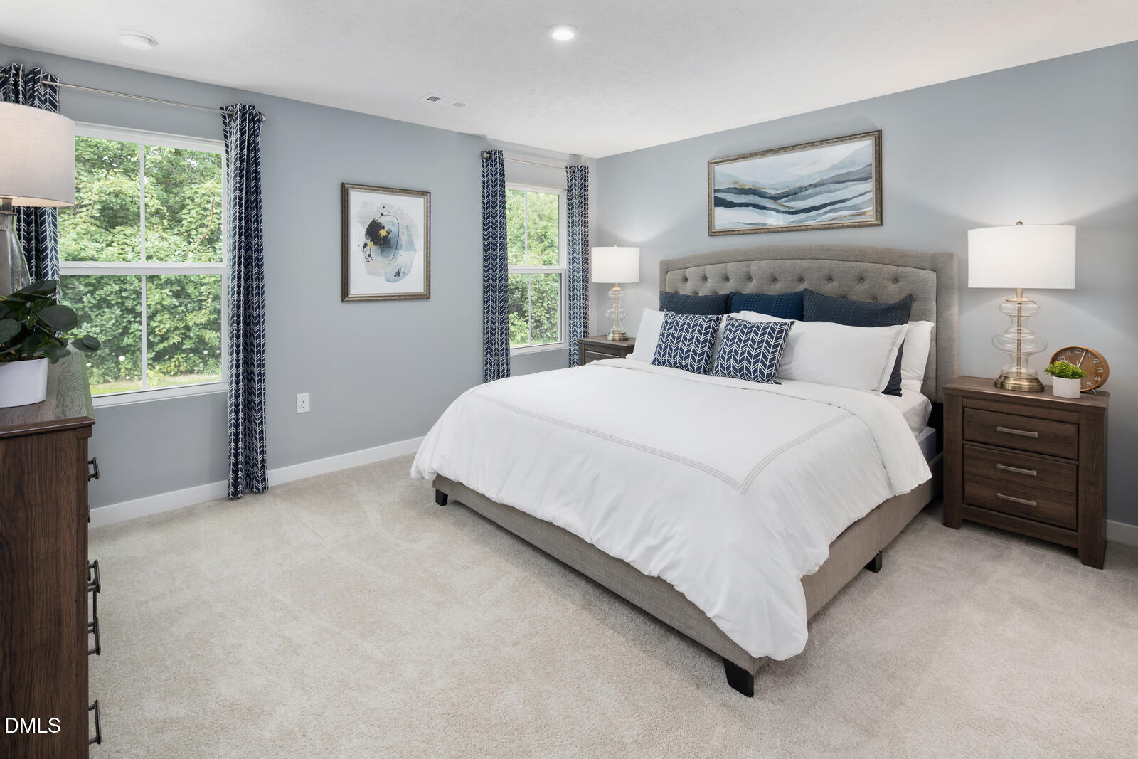 264 Matthiola Drive Wendell, NC 27591 - Photo 18 of 33 a bedroom with a bed painting on the wall and a large window
