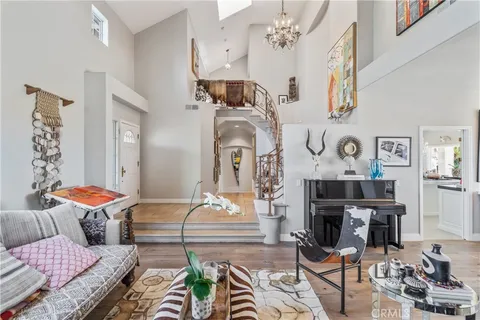 a very nice looking dining room with kitchen island a table and chairs