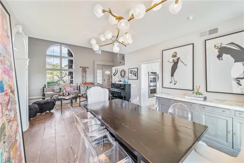 a view of a livingroom with furniture and a floor to ceiling window