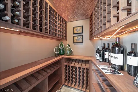 a kitchen with lots of counter top space and painting on the wall