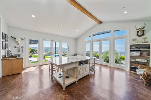 a living room with furniture couches and a flat screen tv