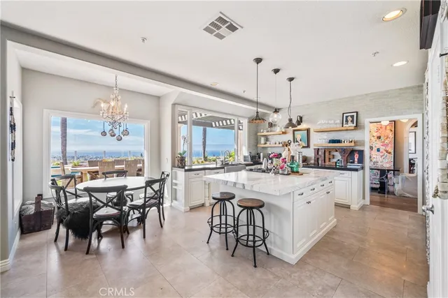a kitchen with sink cabinets and dining table