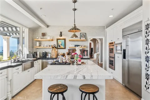 a view of entryway and hall with a front door
