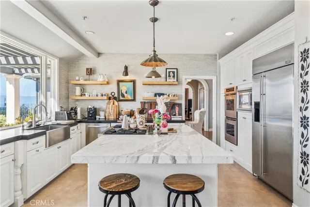 a view of entryway and hall with a front door