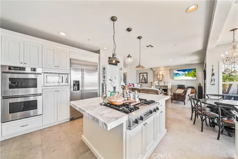 a spacious bedroom with a bed and large windows