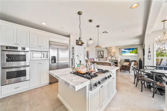 a spacious bedroom with a bed and large windows