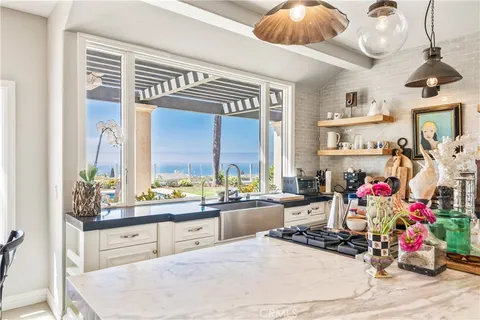 a spacious bedroom with a bed and a flat screen tv