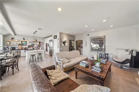 a bathroom with a granite countertop sink and a large mirror