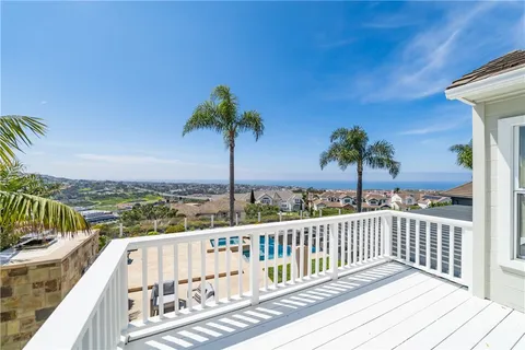 a view of a backyard with a swimming pool