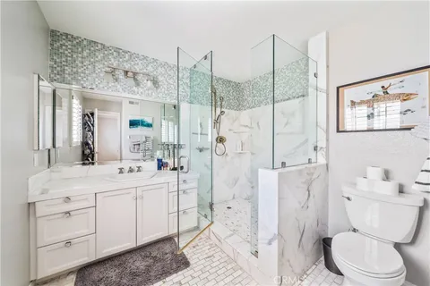 a view of a patio with couches table and chairs and potted plants
