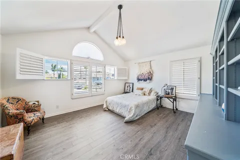 an aerial view of residential houses with outdoor space and river