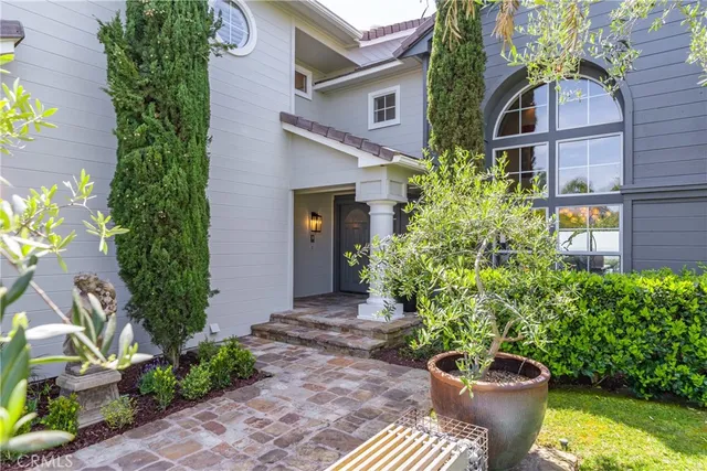 a living room with furniture a fireplace and a large window