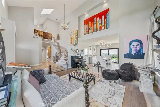 a living room with furniture a rug and a window