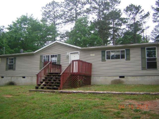 2372 Philadelphia Road Conyers, GA 30012 - Photo 1 of 1 a front view of house with a garden