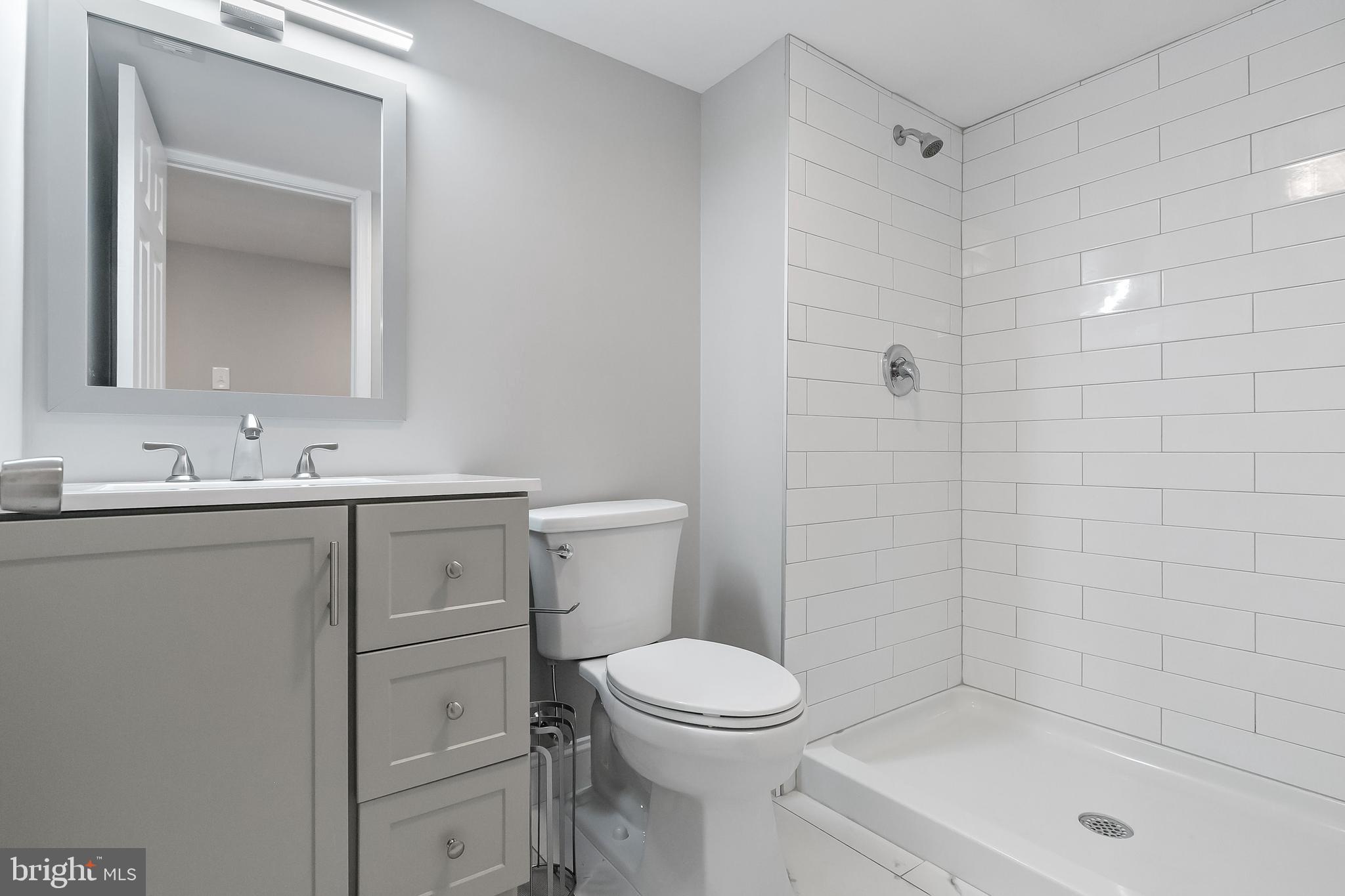 405 Hamilton Road Glassboro, NJ 08028 - Photo 25 of 28 a bathroom with a sink a toilet and shower
