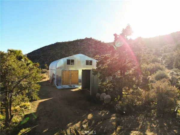 a view of a house with a mountain