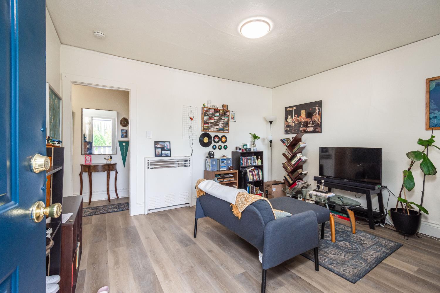 2226 Sutterville Road Sacramento, CA 95822 - Photo 13 of 13 a living room with furniture and a flat screen tv