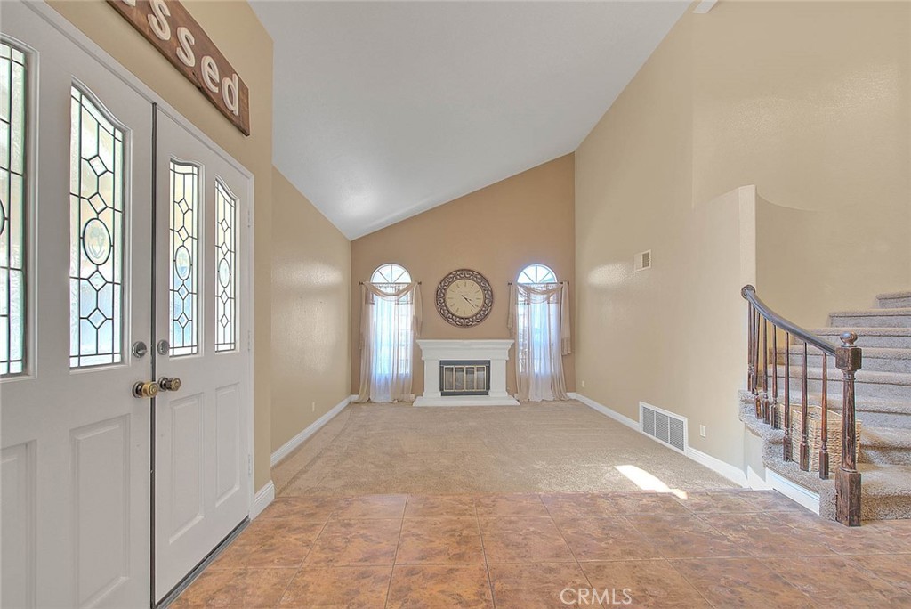 28832 Harwick Drive Highland, CA 92346 - Photo 27 of 62 a living room with furniture and a fireplace