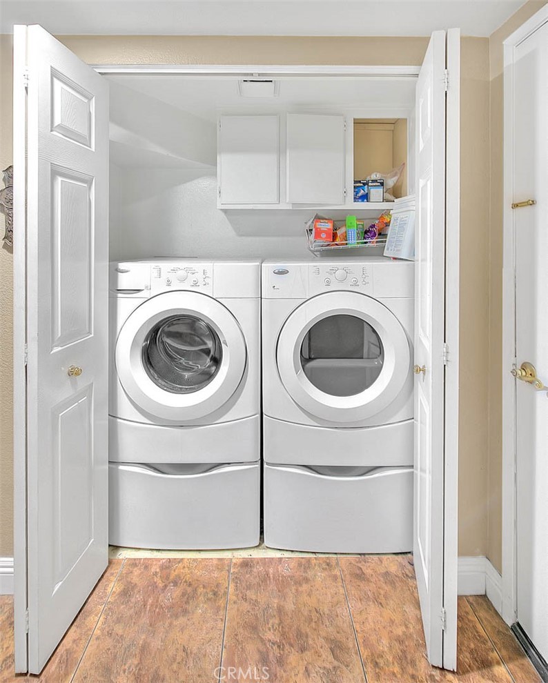 28832 Harwick Drive Highland, CA 92346 - Photo 34 of 62 a utility room with dryer and washer