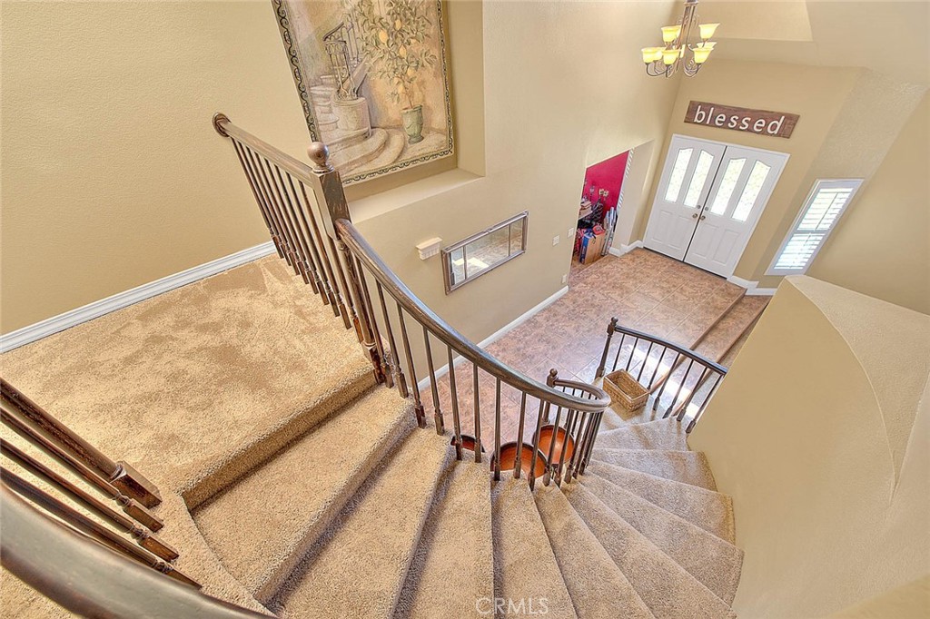 28832 Harwick Drive Highland, CA 92346 - Photo 36 of 62 a view of a hallway with furniture and wooden floor