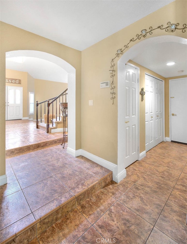 28832 Harwick Drive Highland, CA 92346 - Photo 37 of 62 a view of a hallway with wooden floor